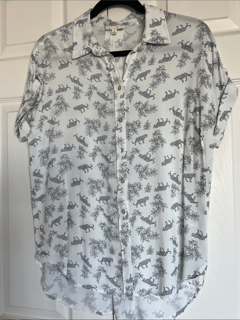 Lightweight White Button-Up Shirt with Black animal print. Longer in back